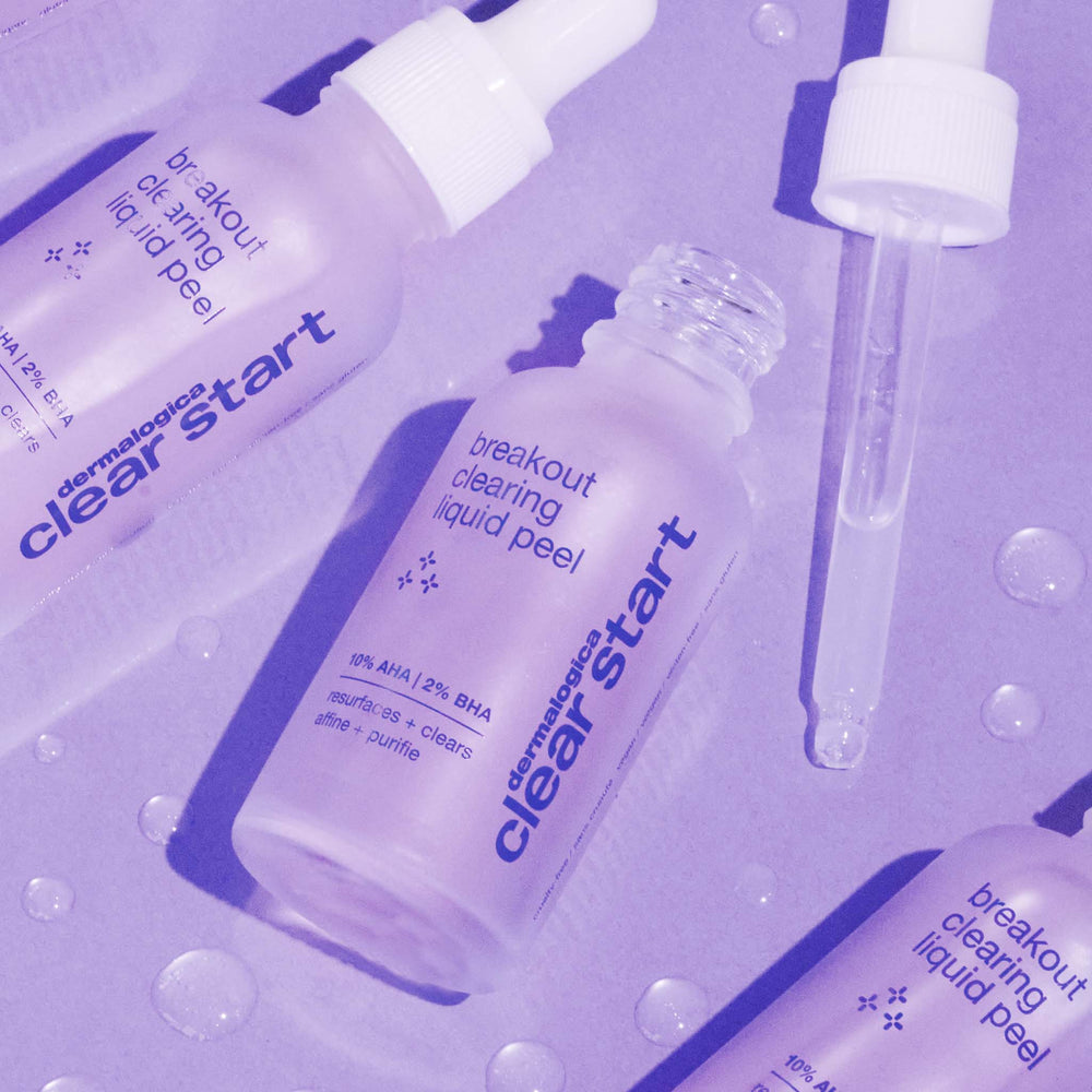 Dermatologist Clear Start breakout clearing liquid peel bottles with droppers on a purple background.