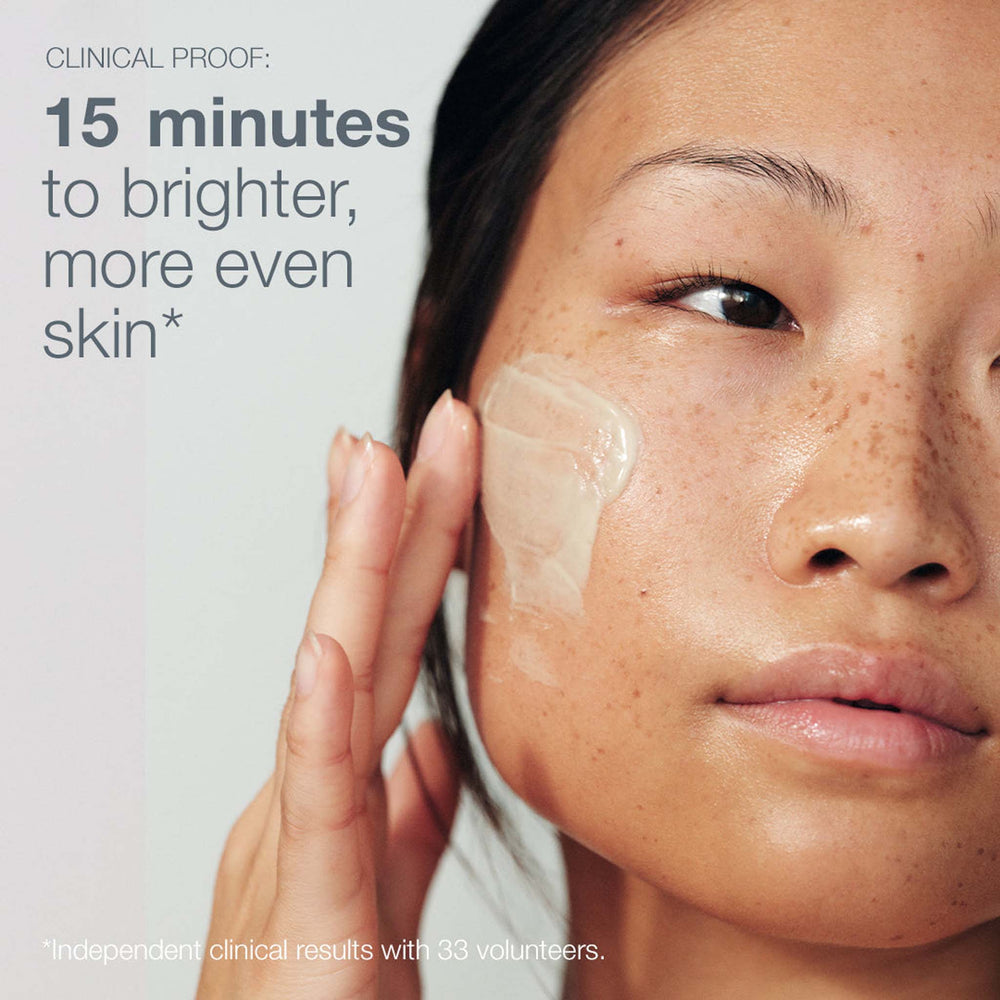 Woman applying powerbright dark spot peel to face with text about skin brightening and evenness.