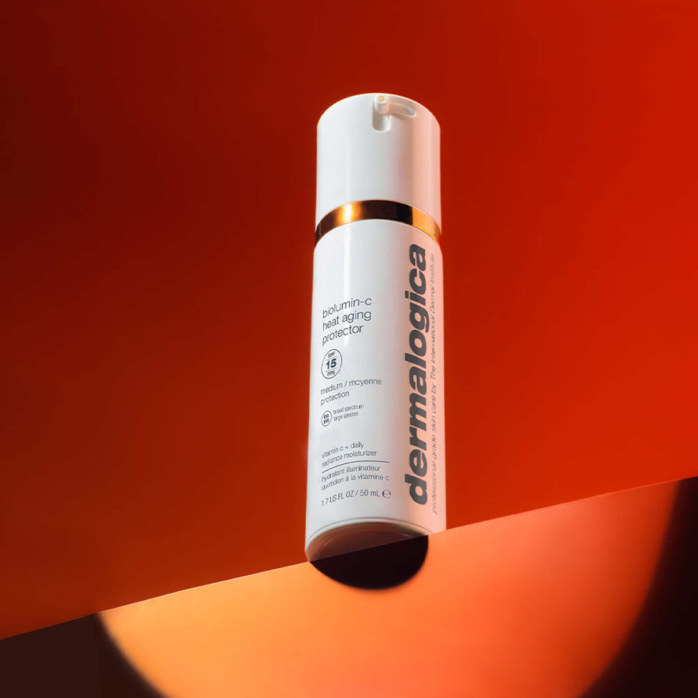 dermalogica biolumin-c heat aging protector spf15 on a gradient red and orange background
