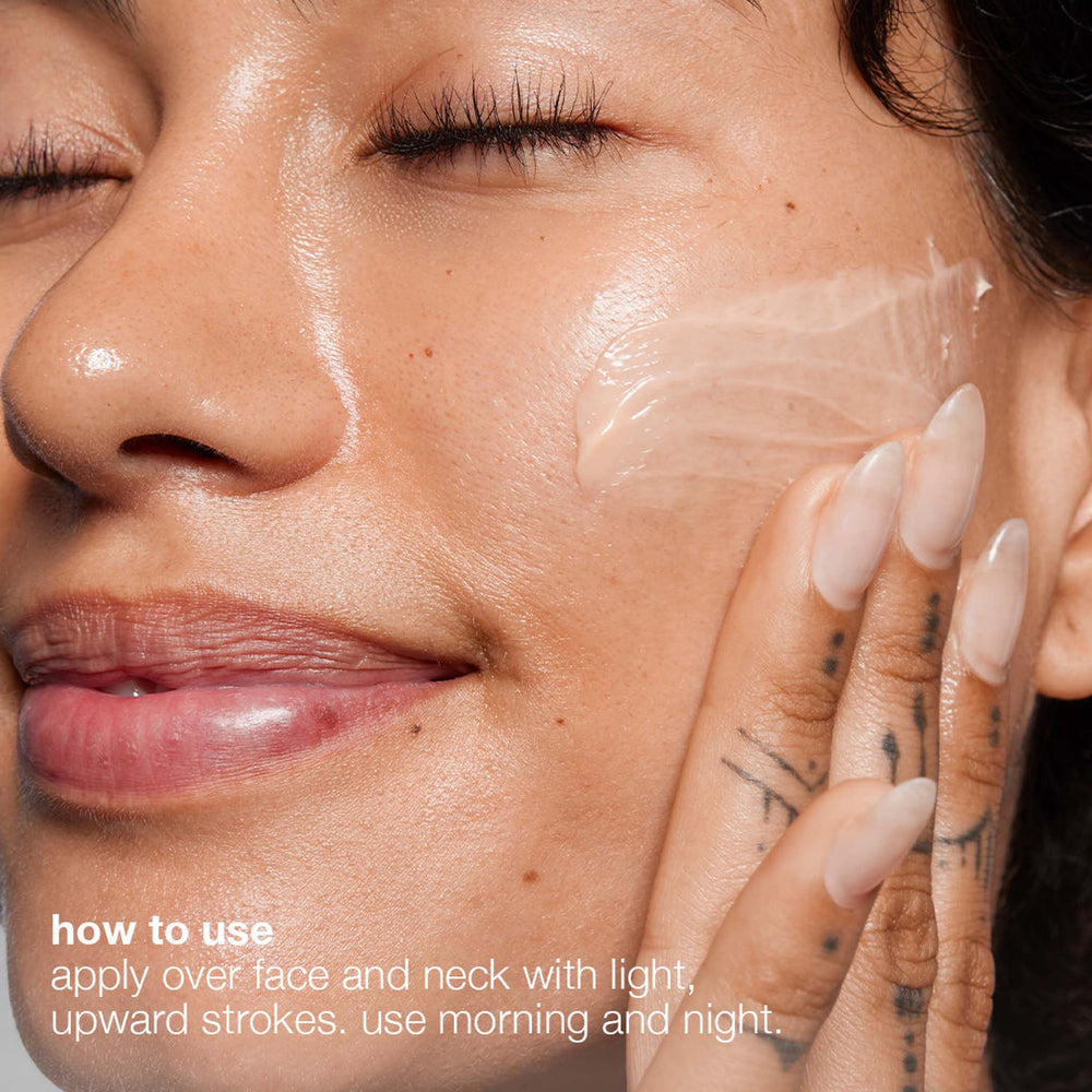 Close-up of a woman applying multivitamin power recovery cream to her face with text on how to use it.