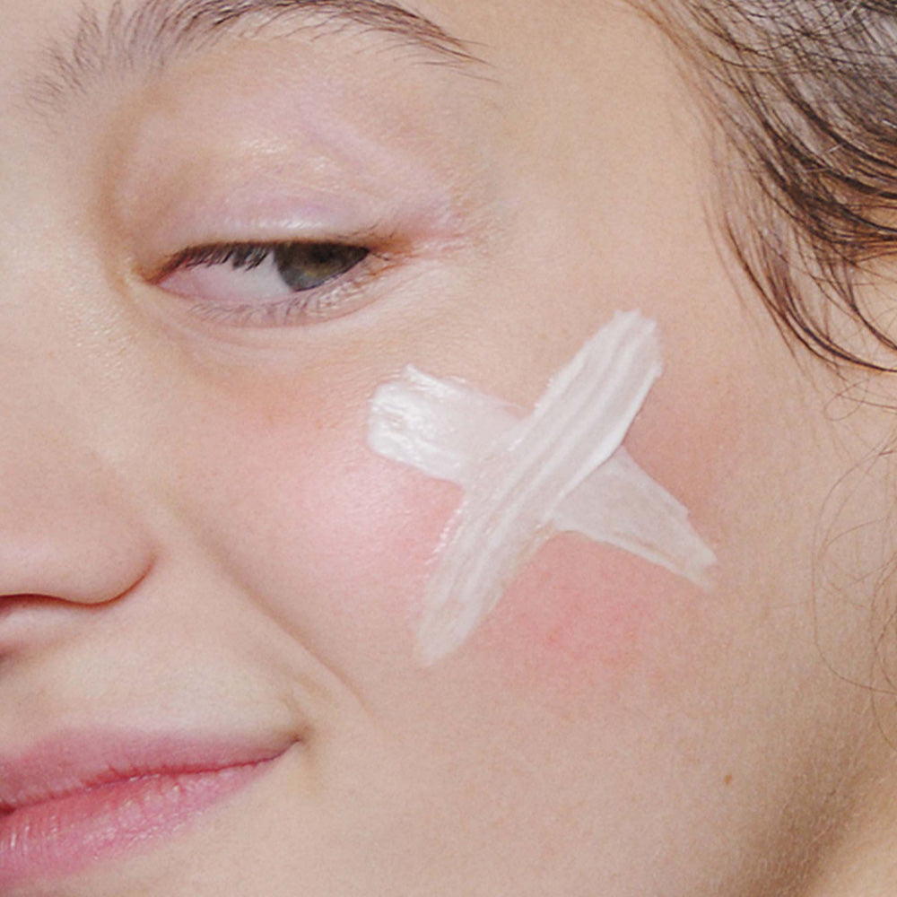 Close-up of a person's face with dermalogica stabilising repair cream applied to the skin.