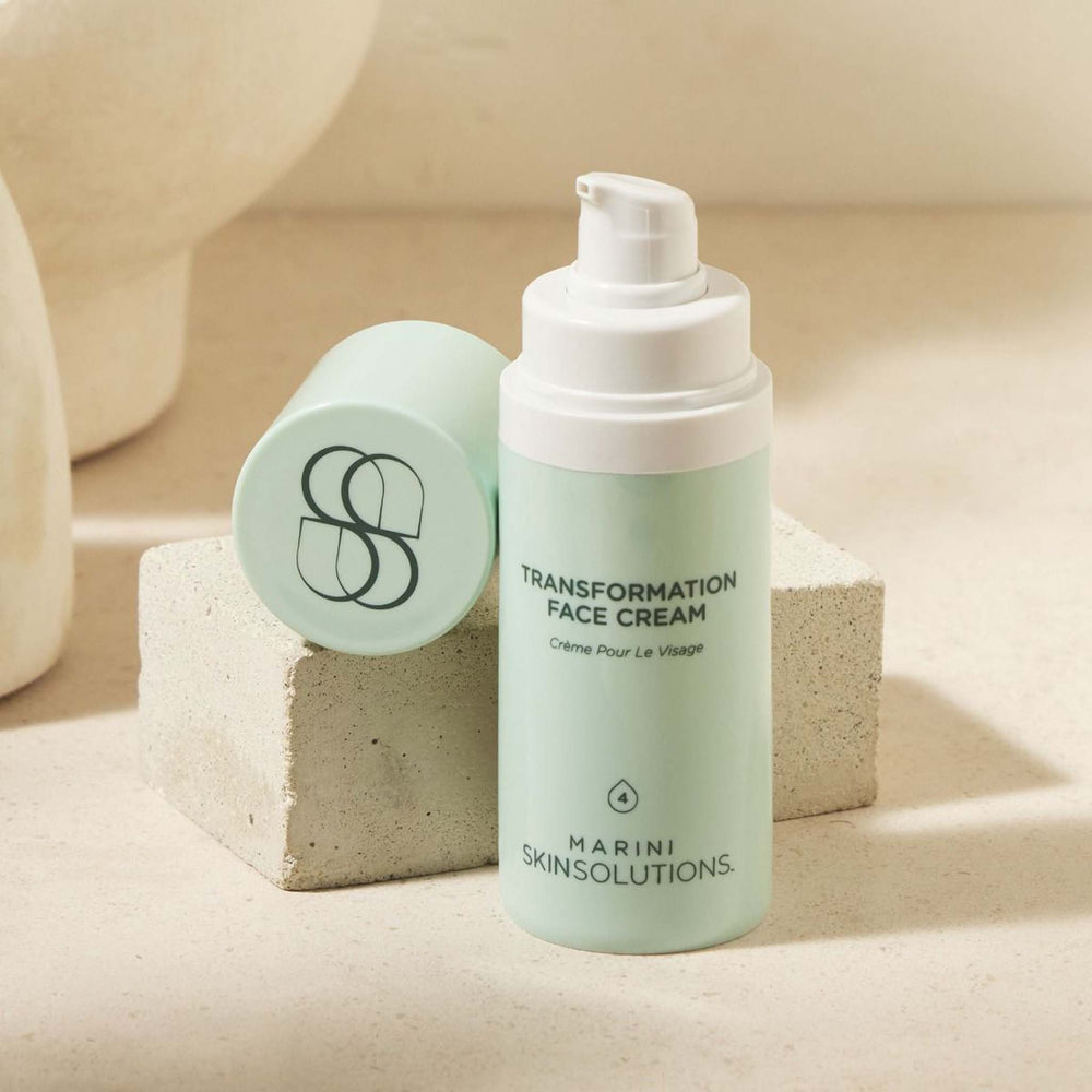 Skincare cream bottle labeled 'Transformation Face Cream' by Marini Skinsolutions on a neutral background.